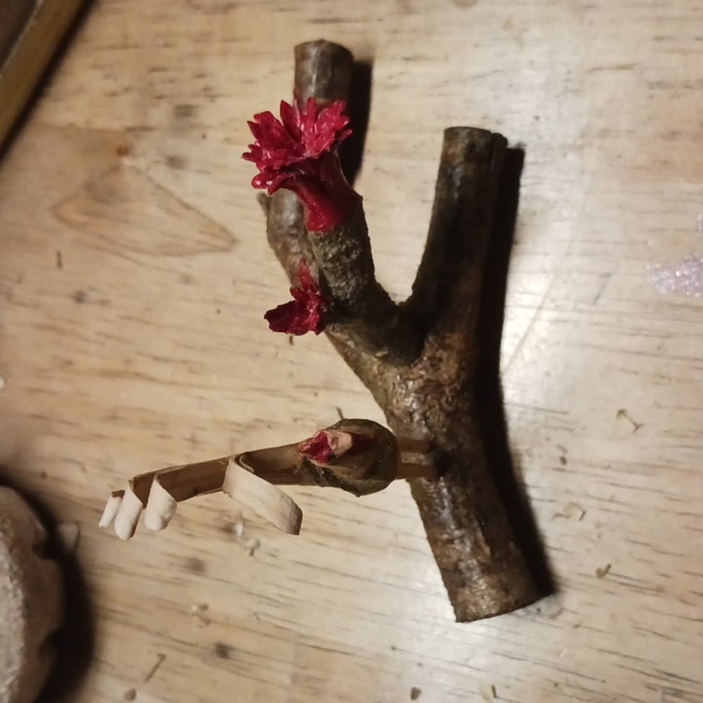 Rooster on branch carving
